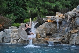 IMG_5946 Woman Going Down Slide into Swimming Pool
